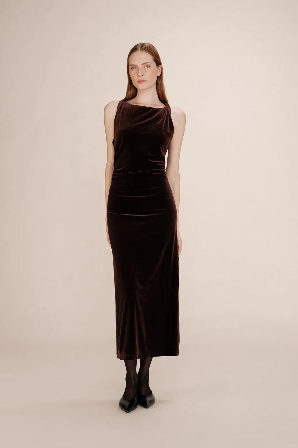 woman wearing a brown velvet dress