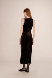 back of a woman wearing a brown velvet dress