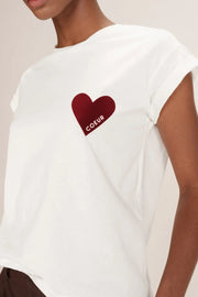 White top with a red heart and 'COEUR' text on a neutral background