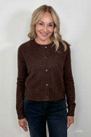 Front facing woman wearing a brown cashmere and silk blend cardigan closed.