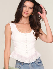 Close up of Woman wearing a white corset top