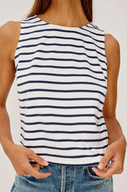 Woman wearing a blue and white striped tank top with a scoop neckline 