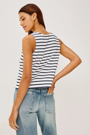 Woman wearing a blue and white striped tank top with a scoop neckline 