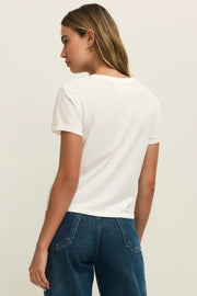 Woman wearing a white crewneck t-shirt with the word "AMOUR" written in red lettering, back view