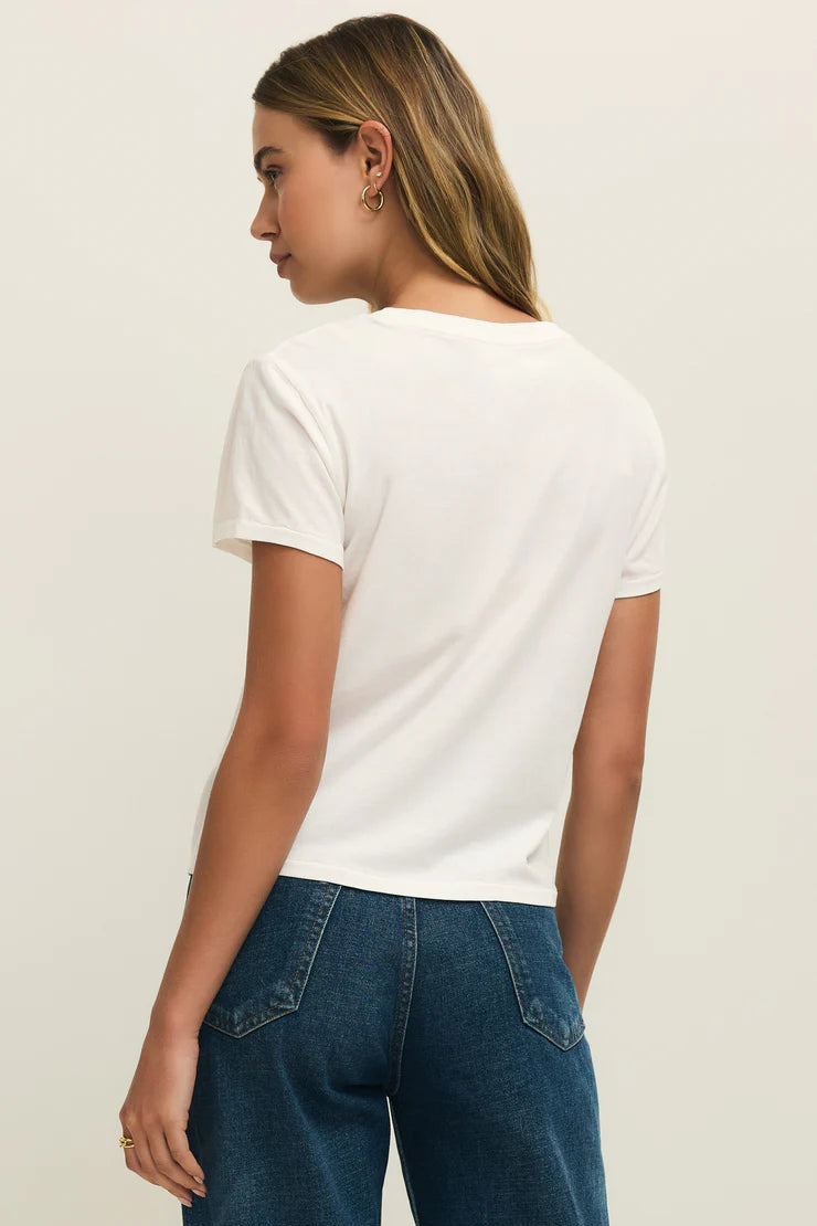 Woman wearing a white crewneck t-shirt with the word "AMOUR" written in red lettering, back view