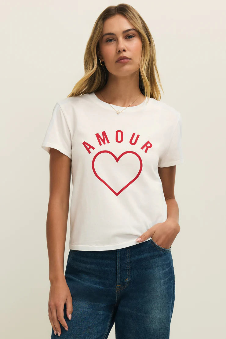 Woman wearing a white crewneck t-shirt with the word "AMOUR" written in red lettering, front view