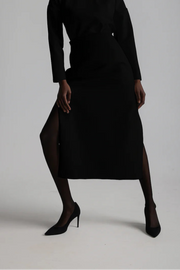 Woman wearing a black skirts with slits in the sides