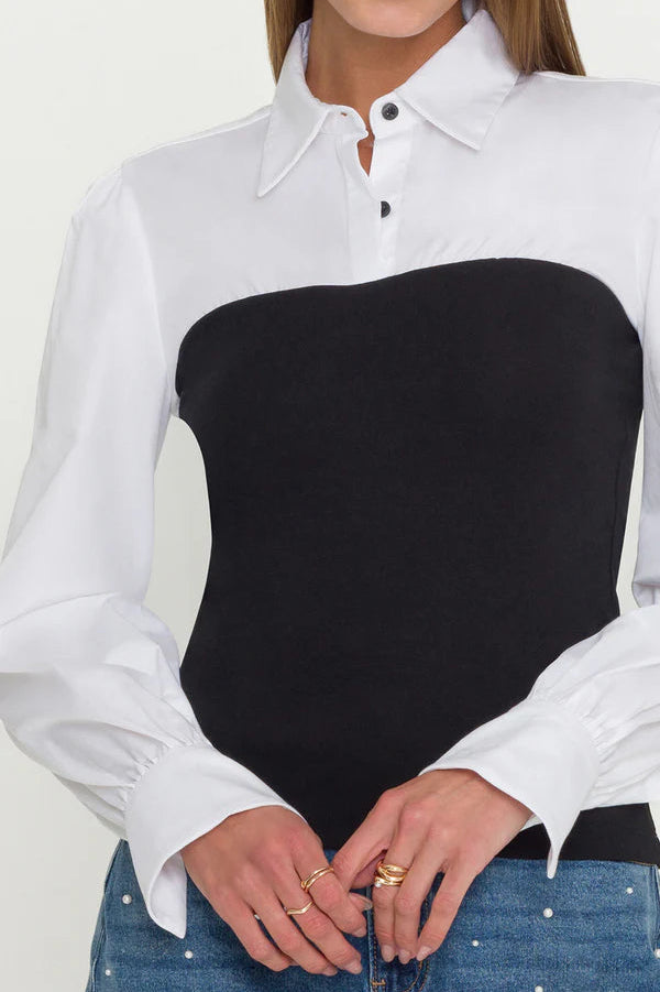 close-up of a combo black franny on a white poplin shirt 