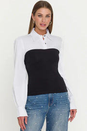 woman wearing a combo black franny on a white poplin shirt 