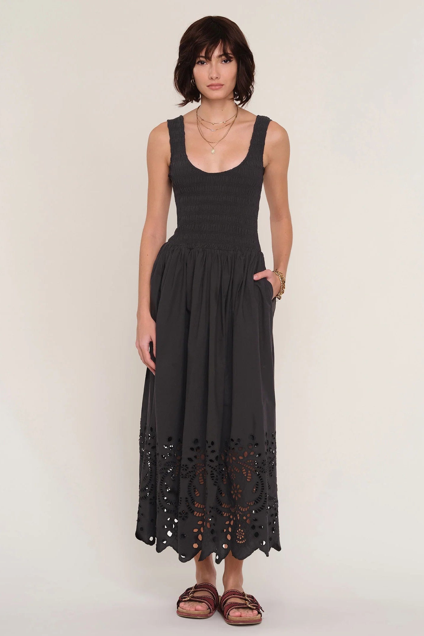 women wearing a black dress with an eyelet skirt