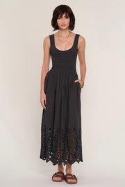 women wearing a black dress with an eyelet skirt