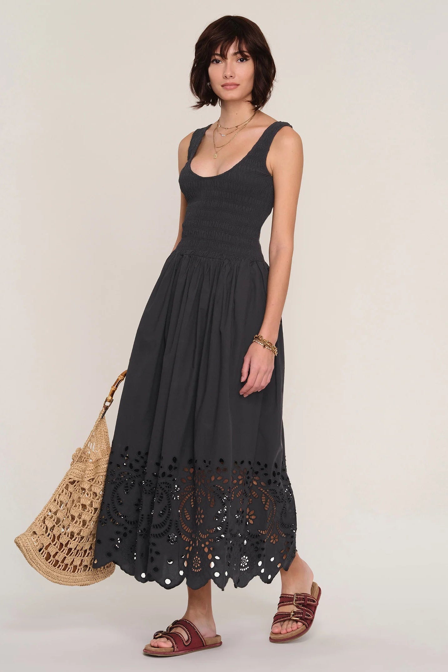 women wearing a black dress with an eyelet skirt