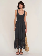 women wearing a black dress with an eyelet skirt