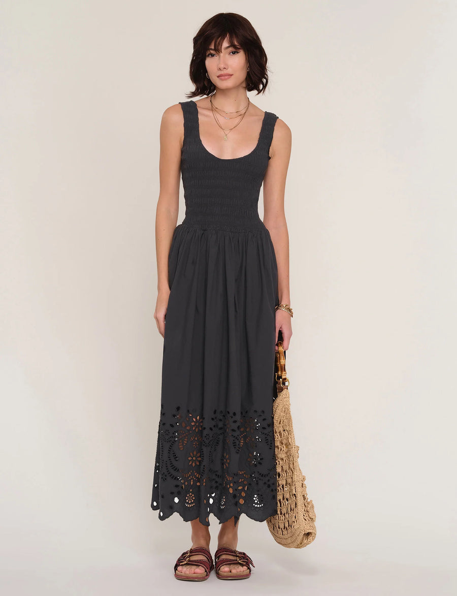 women wearing a black dress with an eyelet skirt