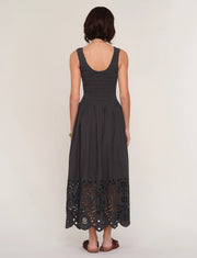 women wearing a black dress with an eyelet skirt