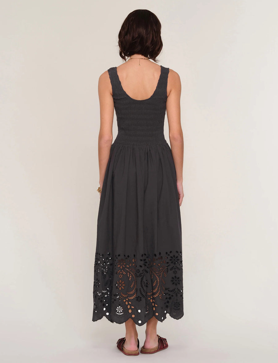 women wearing a black dress with an eyelet skirt