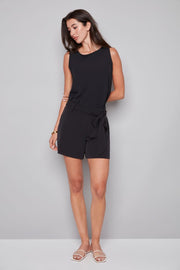 woman wearing sleeveless vegan silk black top