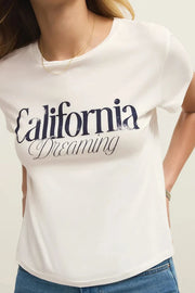 Close up of Woman wearing a white tee shirt with California dreaming graphic on front