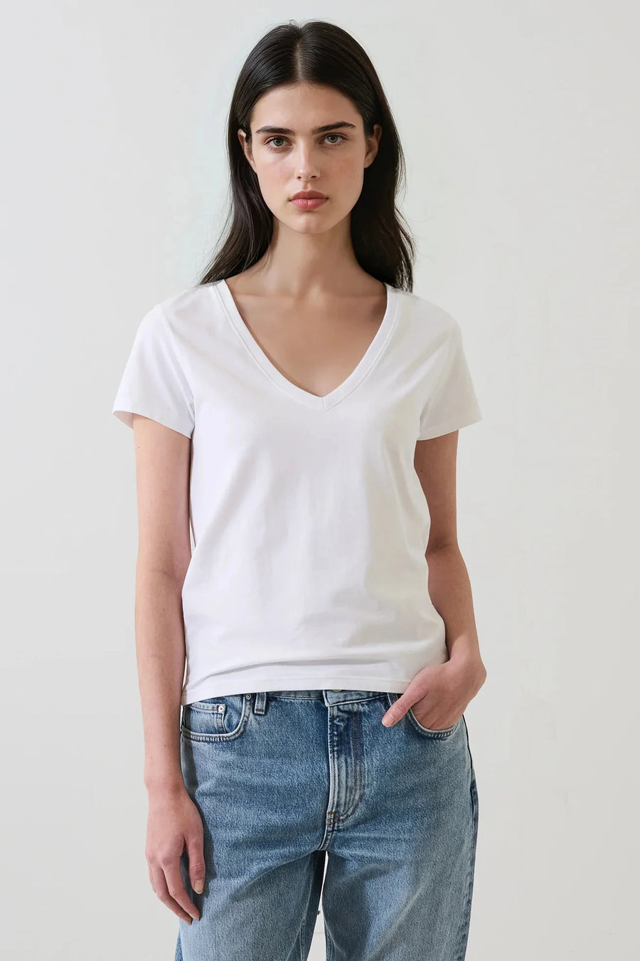 Woman wearing a white v neck tee