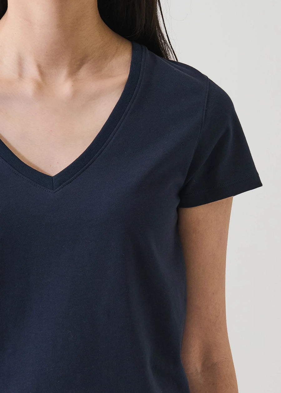 Close up of woman wearing a dark navy v neck tee shirt