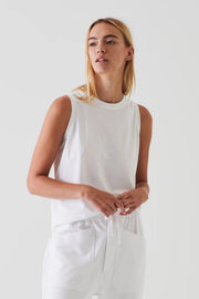 Woman wearing a white boyfriend fit tanktop