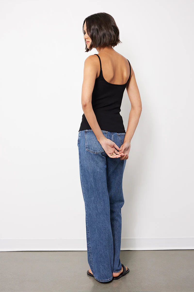 Back view of woman wearing a black tank top