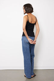 Back view of woman wearing a black tank top