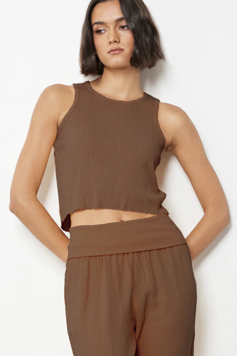 Woman wearing A mocha brown cropped rib tank top