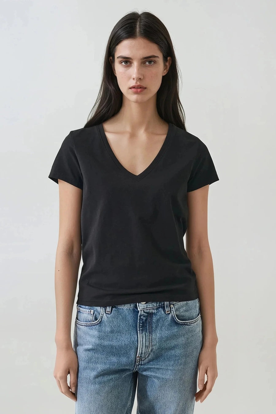 Woman wearing a black v neck tee