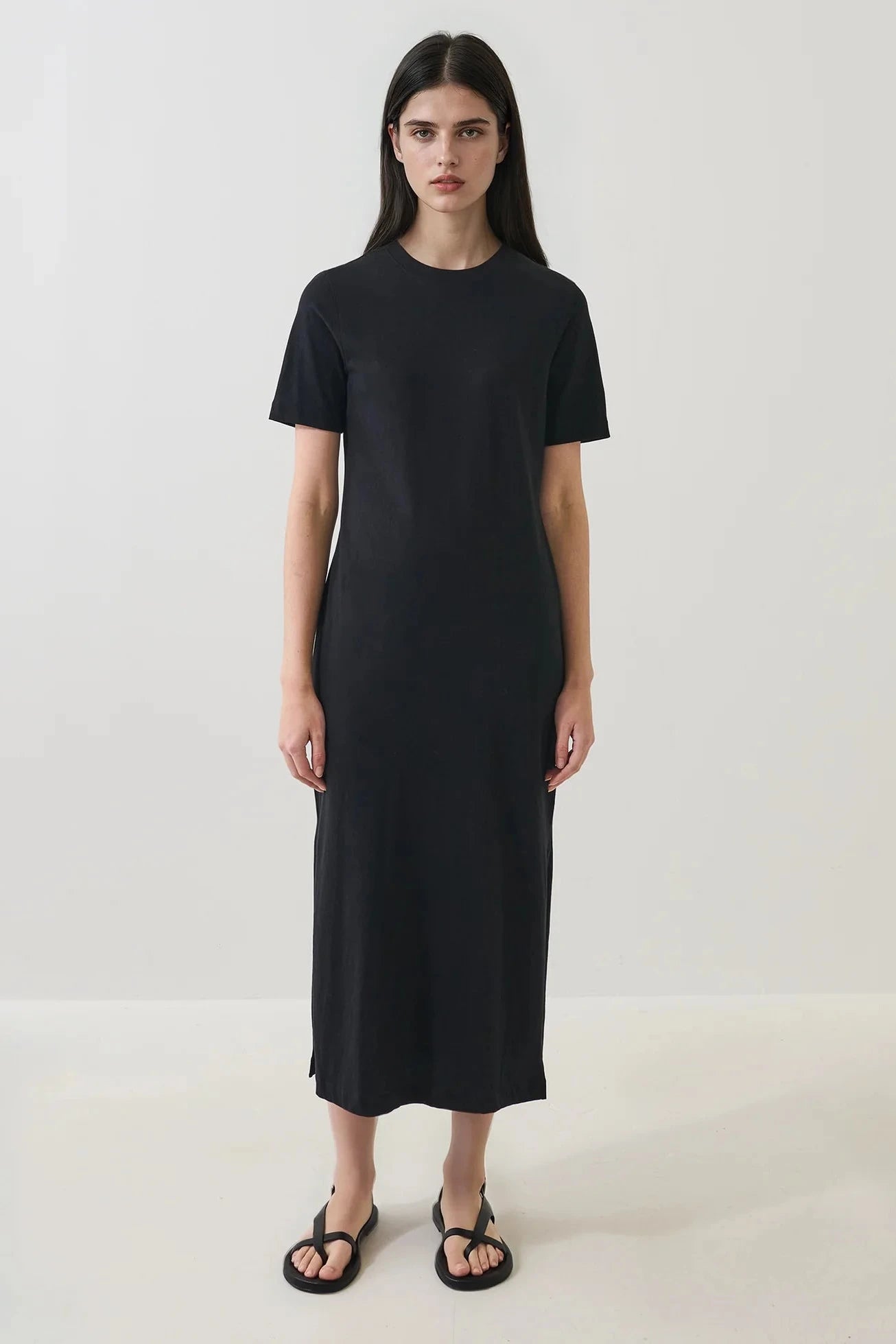 Woman wearing a black tee shirt dress