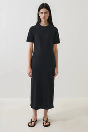 Woman wearing a black tee shirt dress