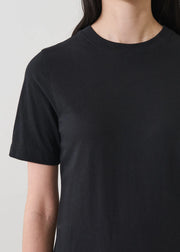Close up of woman wearing a black tee shirt dress
