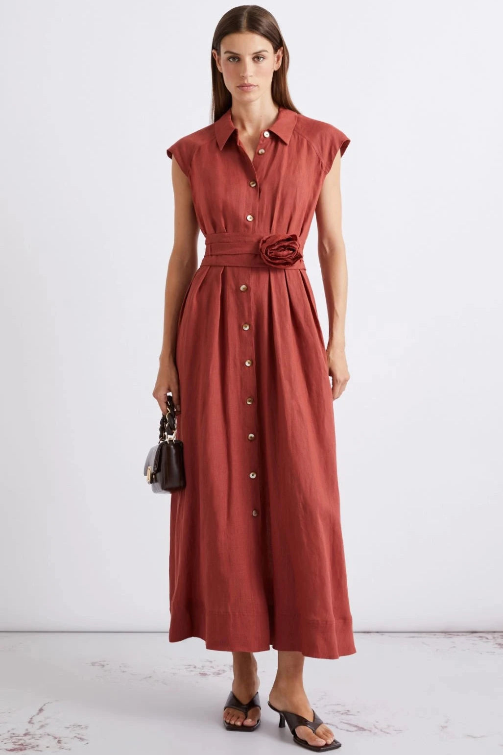 Woman wearing a dark red midi dress