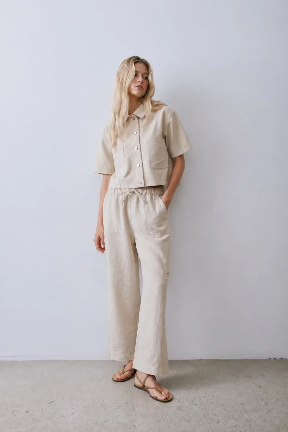 Woman wearing beige pants with draw string