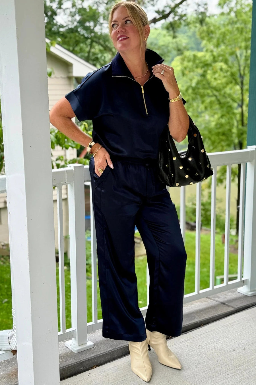 woman  wearing navy blue tie up satin pants 