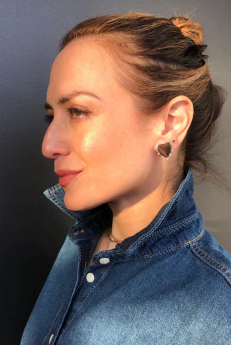 woman wearing a heart shaped earring