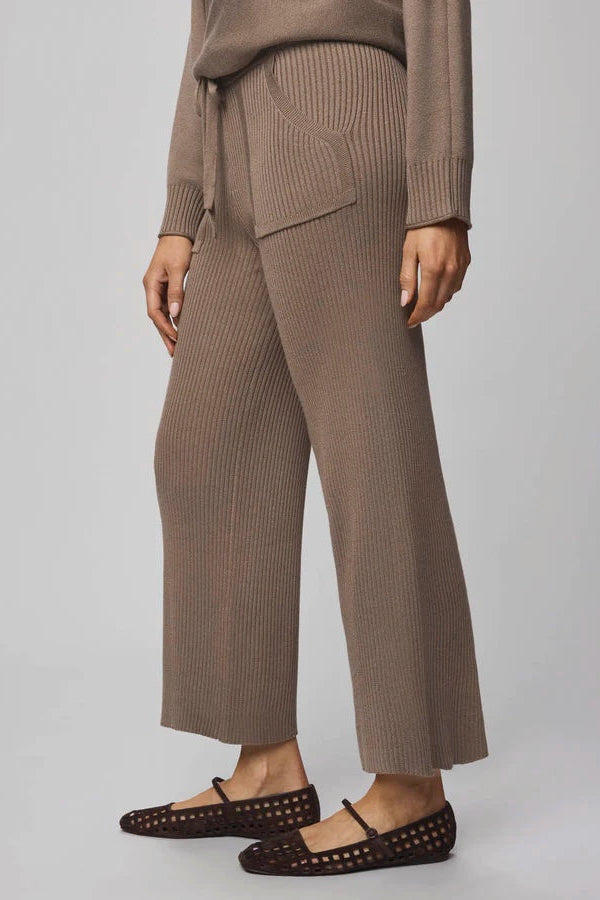 Brown ribbed knit outfit with wide-leg pants on a plain background