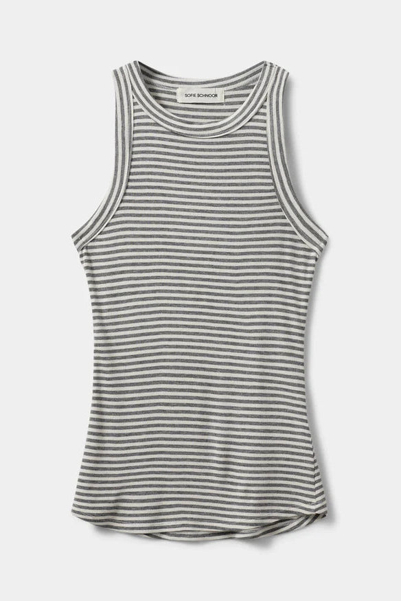 Woman wearing a grey and white striped sleeveless tank top with a fitted silhouette, front