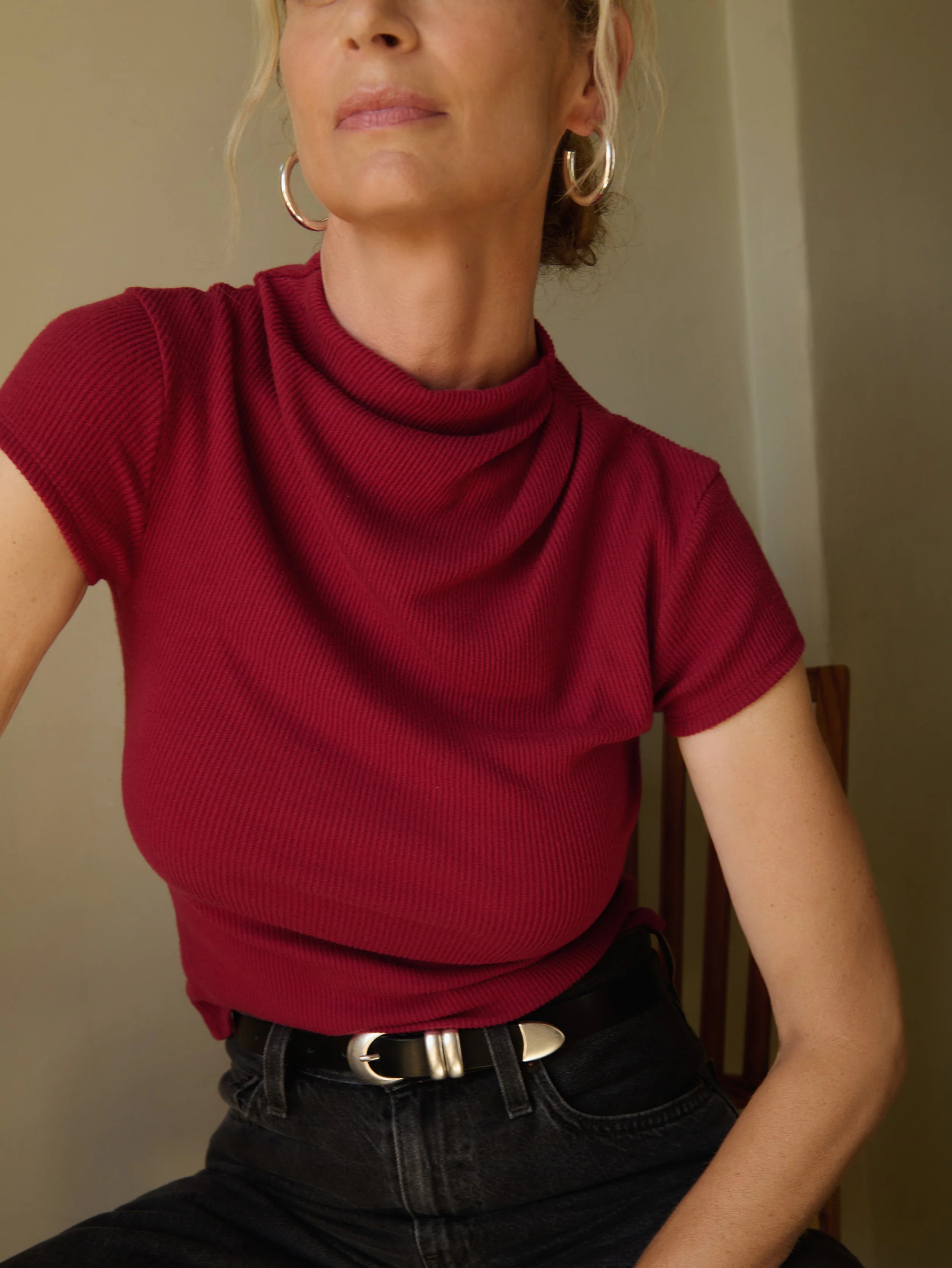 Close-up of a a red drape-neck top 
