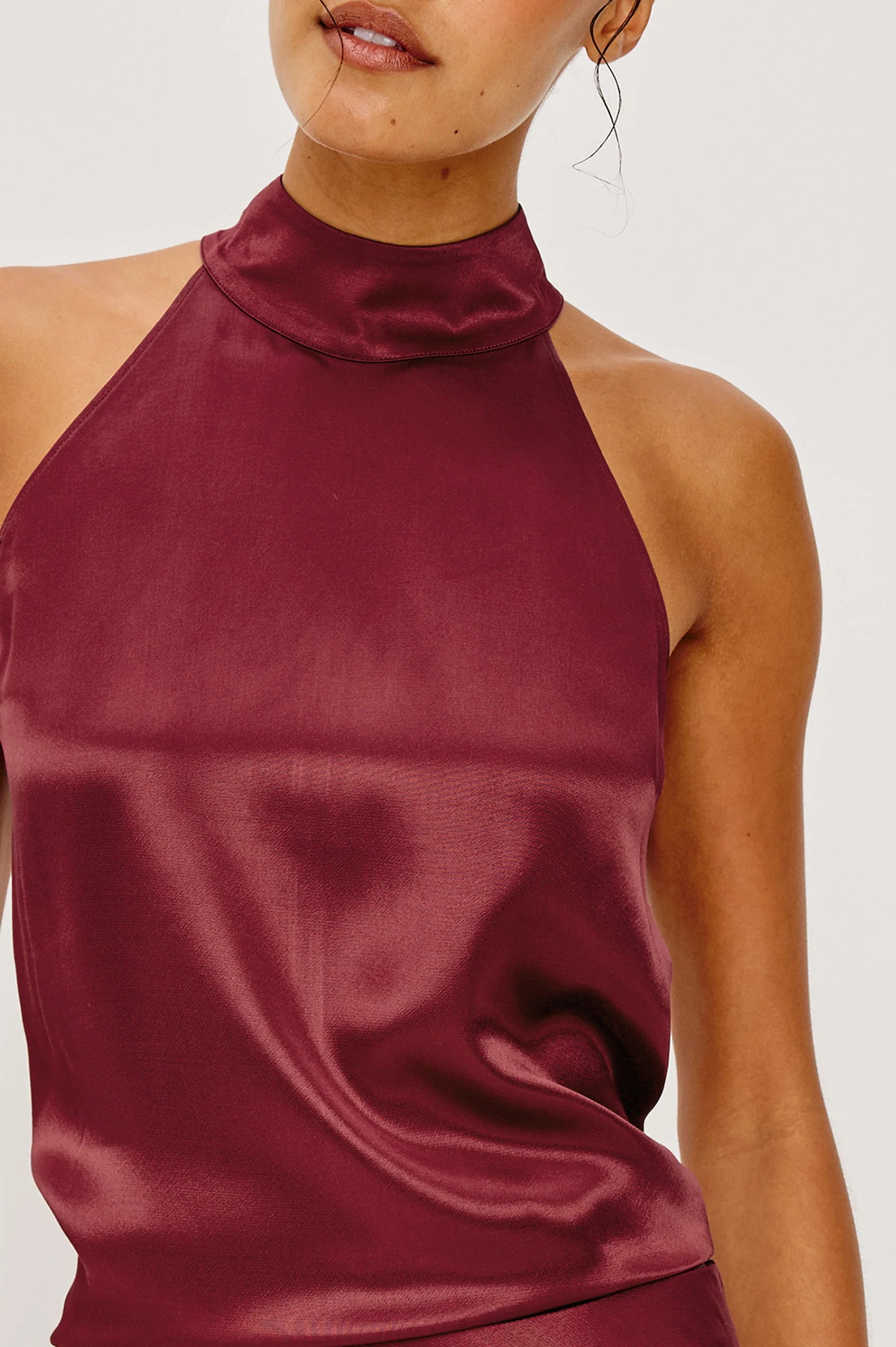 close up of a garnet satin halter top