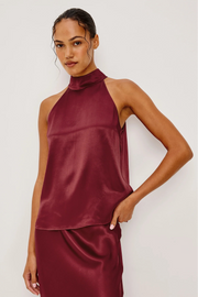 woman wearing a wine red halter top