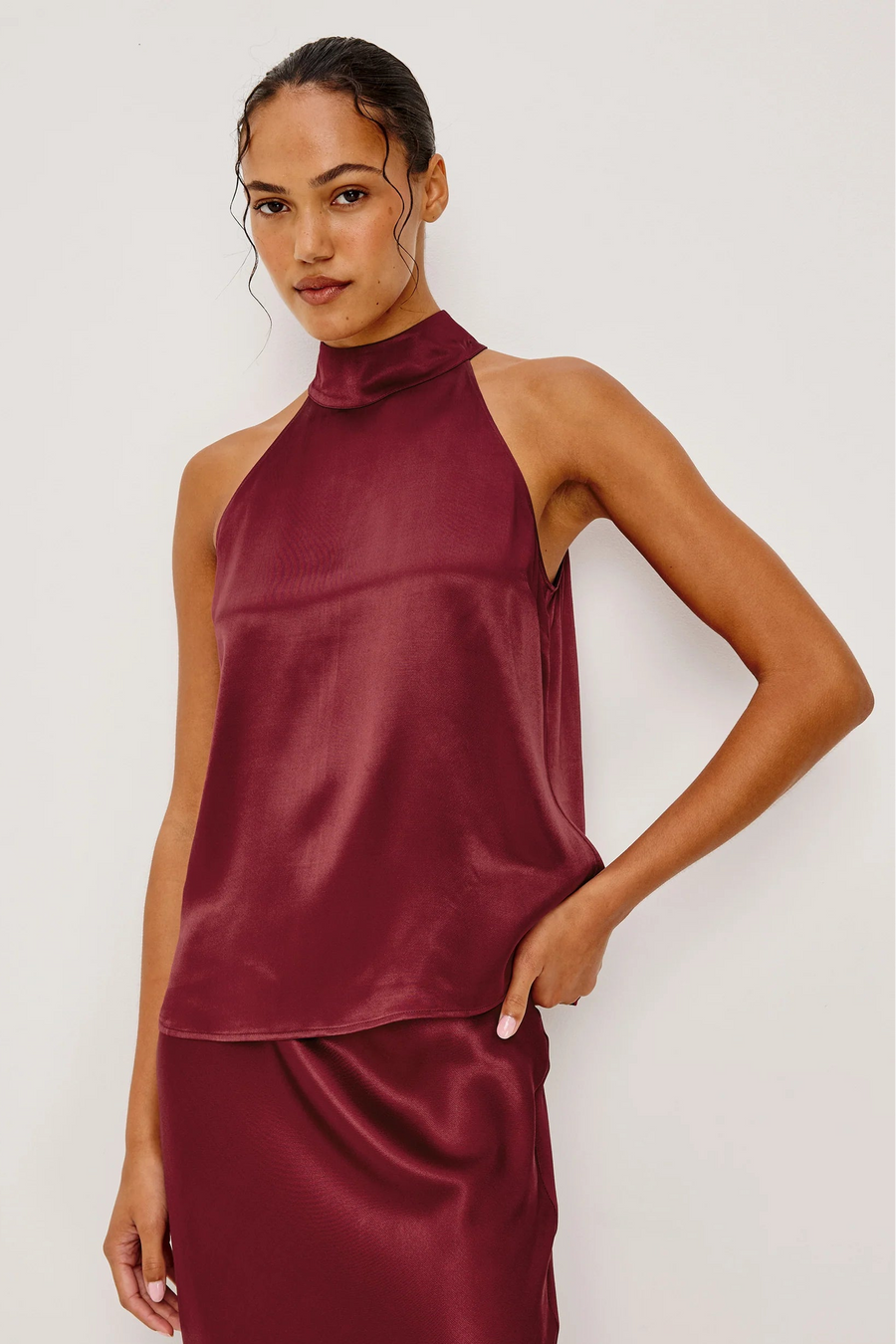 woman wearing a wine red halter top