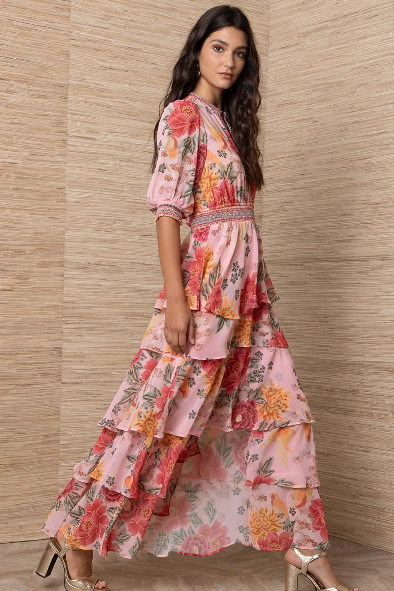 Woman wearing a floral dress.