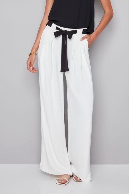 woman wearing a white pant with white shash belt 