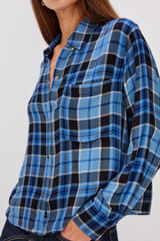 woman wearing blue plaid button up