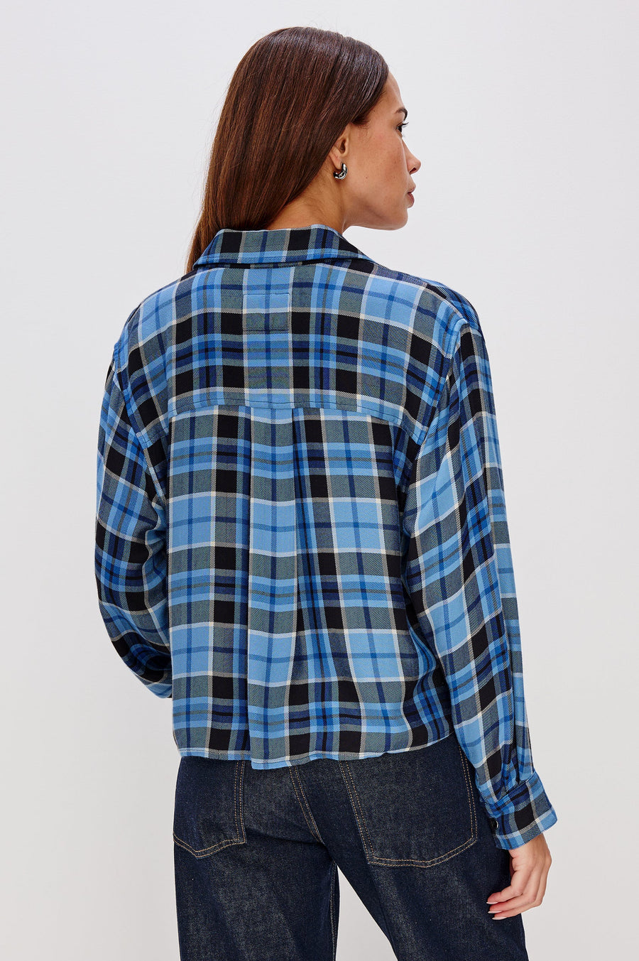 woman wearing blue plaid button up