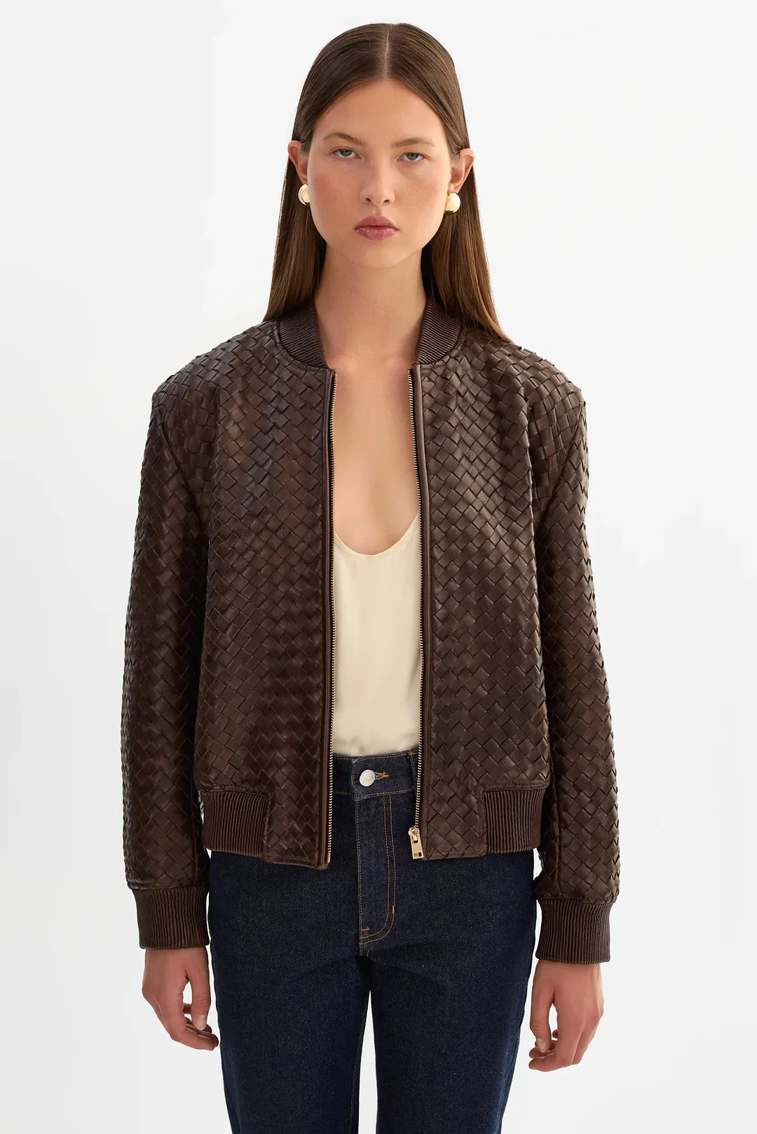 woman wearing brown basket weave jacket 