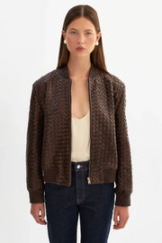 woman wearing brown basket weave jacket 