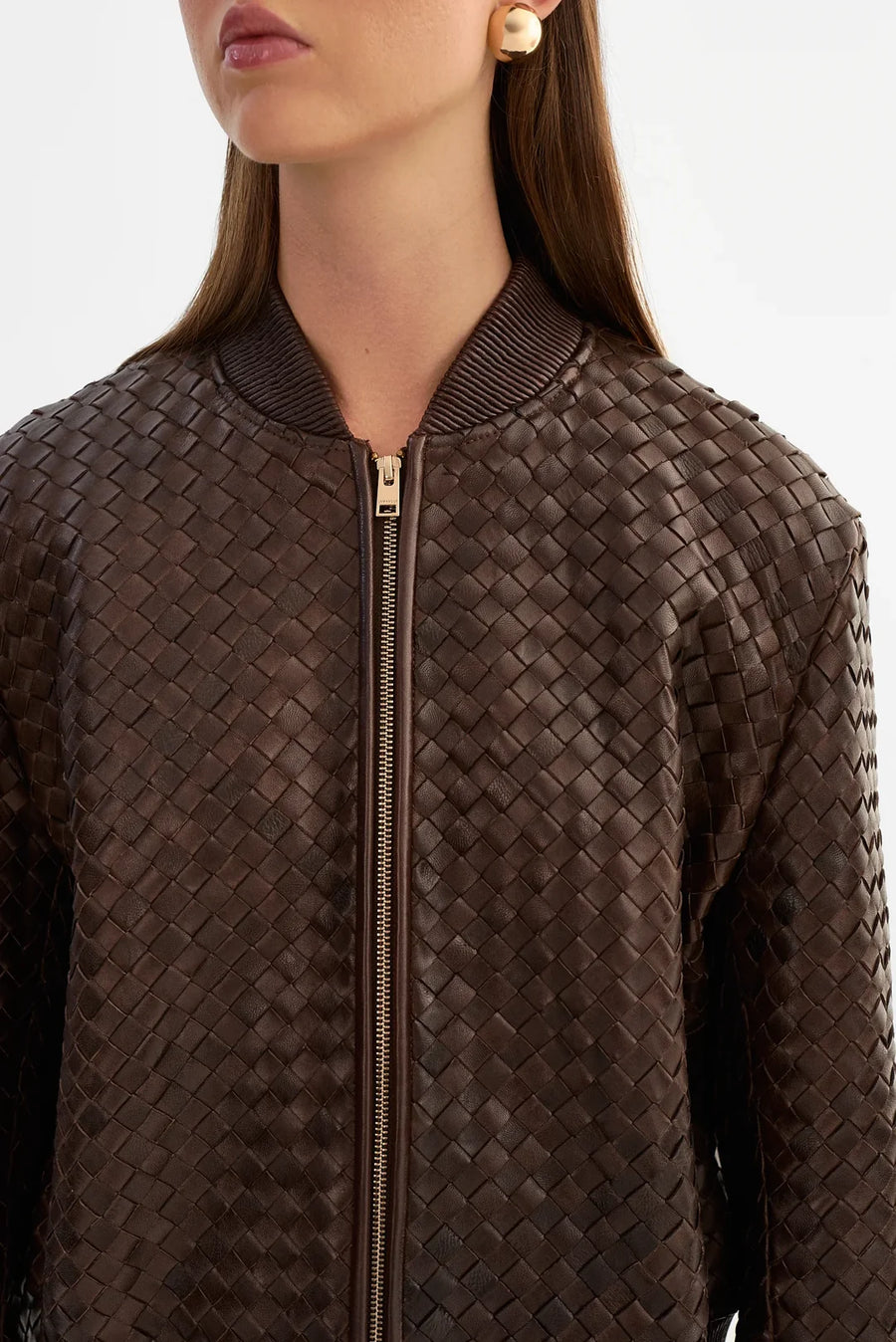 woman wearing brown basket weave jacket 