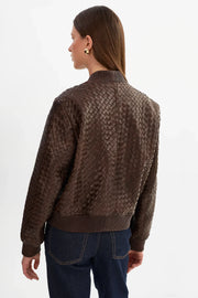 woman wearing brown basket weave jacket 